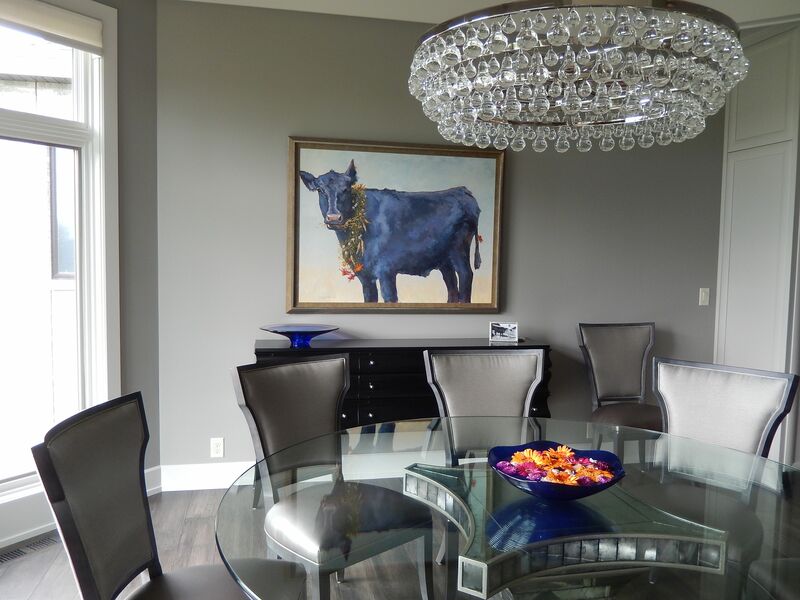 A beautiful room featuring an oil painting of  the owner's 4-H heifer.